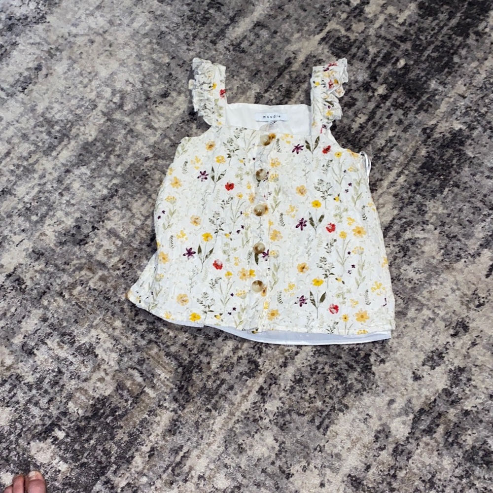 White blouse with different colored flowers